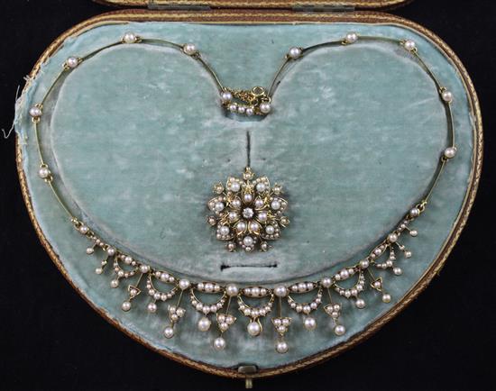 A cased Edwardian gold and split pearl set drop fringe necklace and detachable pendant brooch, necklace approx. 16.5in.